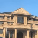 天津黄金麻别墅外墙干挂石材效果示例